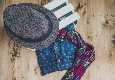 Set of clothes and various accessories for men on old wooden tableの写真素材