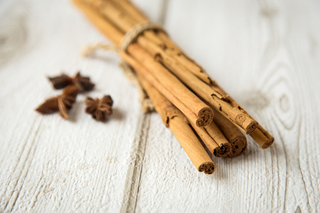 Aromatic cinnamon sticks tied with a rope with star aniseの写真素材