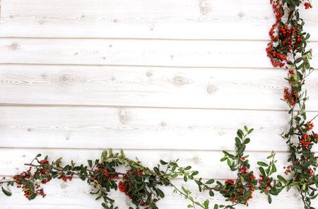 Typical Christmas ornaments in red on old wooden backgroundの写真素材