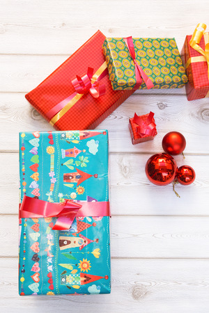 Gift boxes with colored paper and Christmas decorationの写真素材