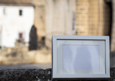White photo frame with the background scenery and streetsの写真素材
