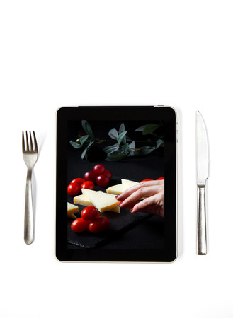 Photo typical Spanish Manchego cheese with grapes on tablet indoorsの写真素材
