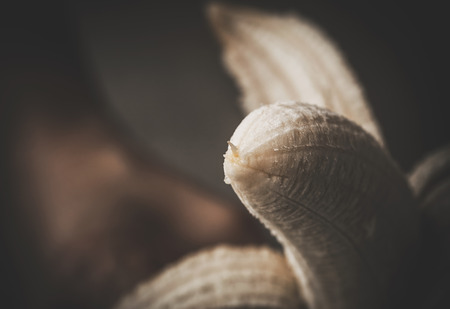 Close-up of hand holding delicious banana.Unrecognizableの写真素材