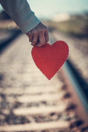 Close-up of hand holding Red heart.の写真素材