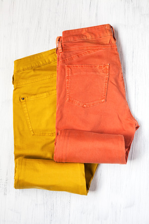 Close-up of Clothing and fashion accessories on wooden table,pants;の写真素材