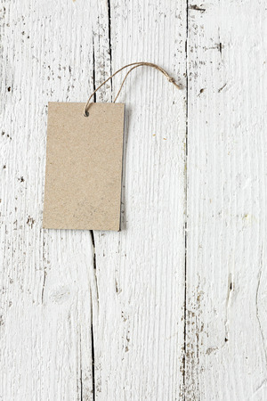 View on  paper badges on shabby wooden background.From aboveの写真素材
