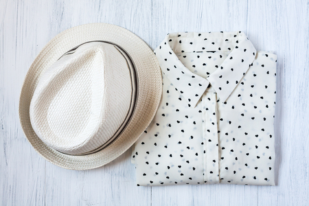 Close-up of Clothing and fashion accessories on wooden tableの写真素材