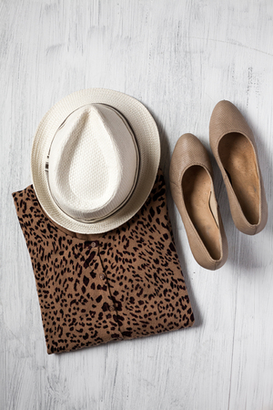 Close-up of Clothing and fashion accessories on wooden tableの写真素材