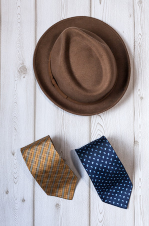 Close-up of Clothing and fashion accessories on wooden tableの写真素材