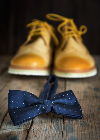 Close-up of Clothing and fashion accessories on wooden tableの写真素材