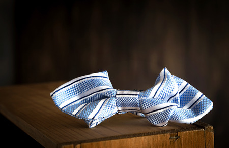 Close-up of Clothing and fashion accessories on wooden tableの写真素材