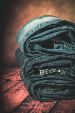 Close-up of Clothing and fashion accessories on wooden tableの写真素材