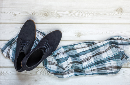 Close-up of Clothing and fashion accessories on wooden table from aboveの写真素材