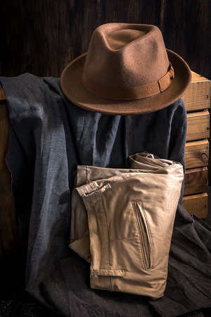 Close-up of Clothing and fashion accessories on wooden tableの写真素材