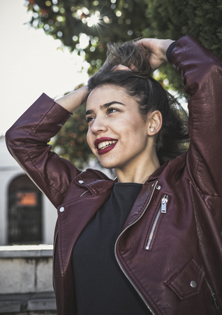 Beautiful blonde girl posing on the streetの写真素材
