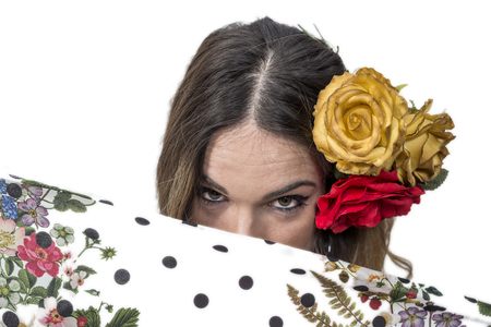 Portrait of young flamenco dancer in beautiful dress with white isolated backgroundの写真素材