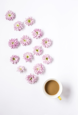 Floral pattern with several colorful flowers and coffee on white tableの写真素材