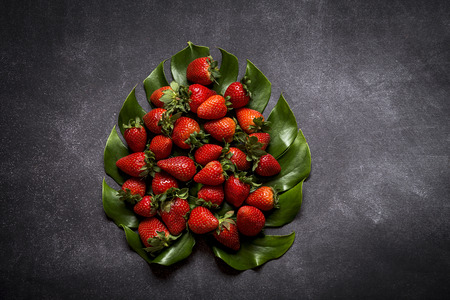 Mix of fresh fruits on black backgroundの写真素材