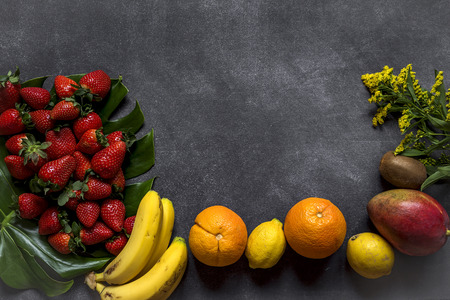 Mix of fresh fruits on black backgroundの写真素材