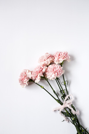 Flowers on white background. Flat lay, top view. Flowers backgroundの写真素材