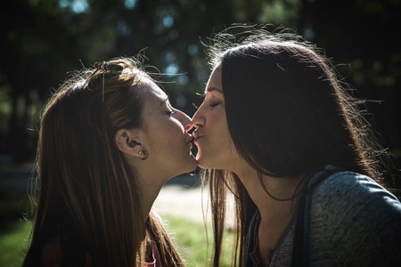 Lesbian Couple Together Outdoors Concept in a park