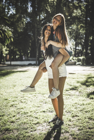 Lesbian Couple Together Outdoors Concept in a parkの写真素材