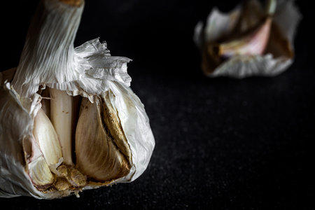 Fresh garlic on old black wood table.Detoxの写真素材