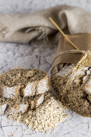 Loaves of integral bread on wooden tableの写真素材