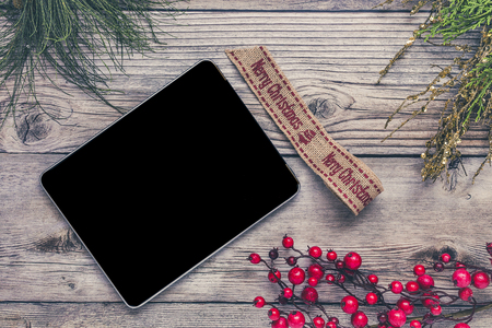 Christmas background with decorations and gift boxes on wooden board. From aboveの写真素材