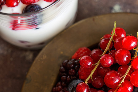 Yogurt with berries, blueberries and raspberries on wooden table. Healthyの写真素材