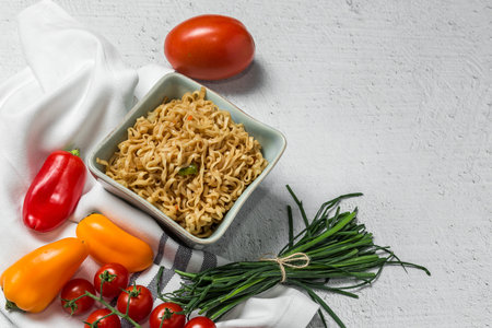 Noodles with vegetables. Typical oriental food. With white background