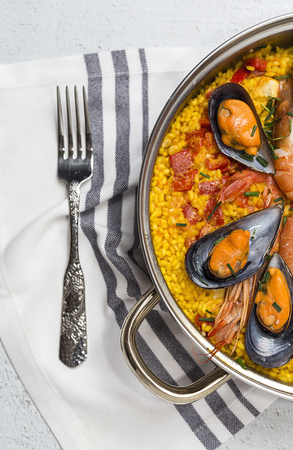 Traditional rice in paella with fish and meat. Typical Spanishの写真素材