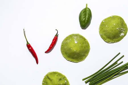 Homemade Italian spinach ravioli stuffed with ricotta cheese from above. Flat lay. Top view. Italian foodの写真素材