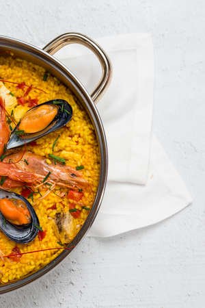 Traditional rice in paella with fish and meat. Typical Spanishの写真素材