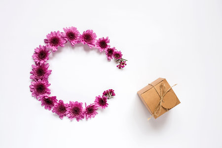 Gift box with string on white background