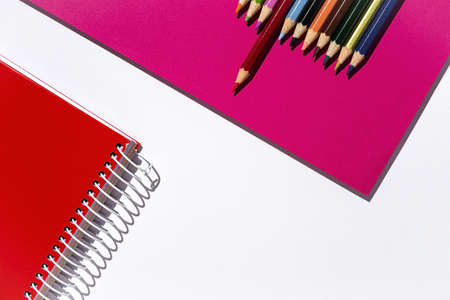 Back to school supplies, notebooks, colored pencils from above. Flat lay. Top viewの写真素材