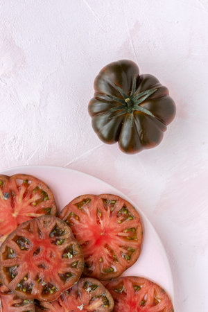 Fresh tomato carpaccio with olive oil and aromatic herbs from above. Flat lay. Vegan foodの写真素材