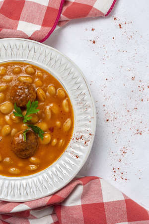 Homemade beans stew with sausage from above. Typical Spanish food. Flat layの写真素材