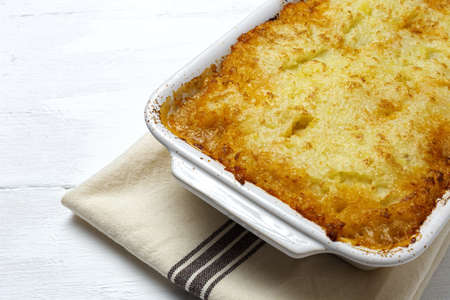 Traditional homemade shepherd pie on white background from above. Cottage foot. English food conceptの写真素材
