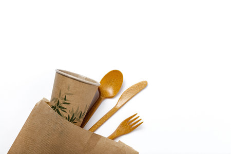 Plastic disposable tableware, forks, spoons, glasses on white background. Caring for the environment. The problem is recycling. Reuse. Place for text.の写真素材