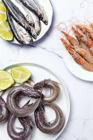 Anchovies, prawns and raw whiting prepared for frying. Typical Spanish food.Healthy foodの写真素材