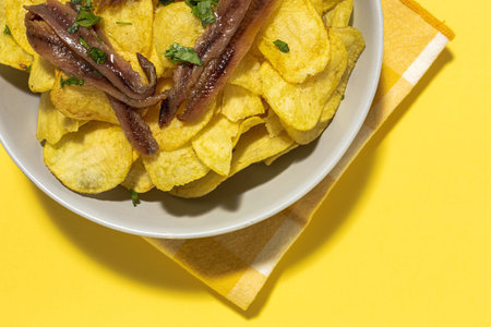 Assortment of potato, fried, cooked, chips and french fries snacks. With sunlightの写真素材