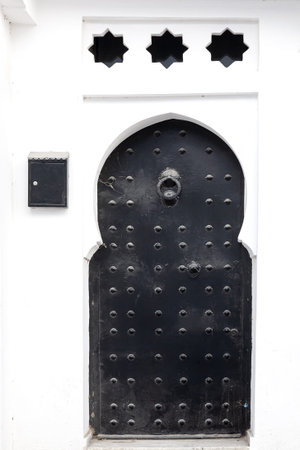 Arab architecture in the old medina. Streets, doors, windows, details. Tangier, Moroccoの写真素材