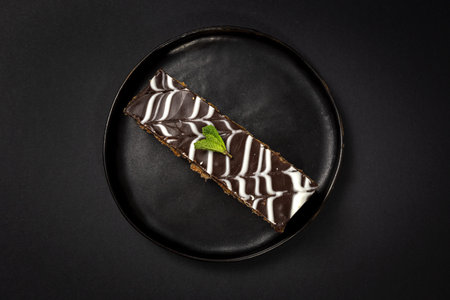 Traditional chocolate Millefoglie or French mille-feuille on dark background with copy spaceの写真素材