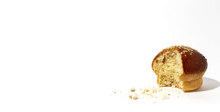 Assorted round homemade brioche buns with seeds on a white background with high contrast light. Isolatedの写真素材