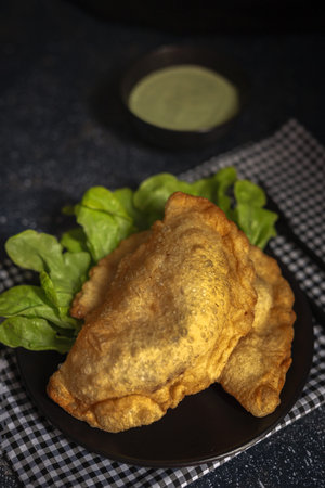 Homemade fried Neapolitan pizza with ham, cheese and pesto sauce. Italian foodの写真素材