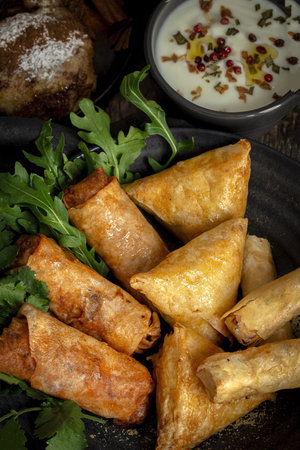 Traditional homemade assortment of moroccan food snacks on dark background. Typical Arab food. Halal...