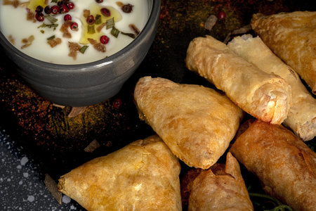 Traditional homemade assortment of moroccan food snacks on dark background. Typical Arab food. Halal...