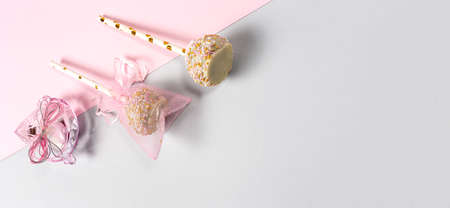 Candy for baby party with candies and cakes on colored backgrounds. Isolatedの写真素材