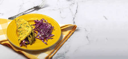 Healthy Homemade Green Asparagus Omelette with Spinach and Purple Cabbage with copy space. Vegan food conceptの写真素材